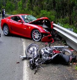 picture of a wreck between a car and a motorcycle