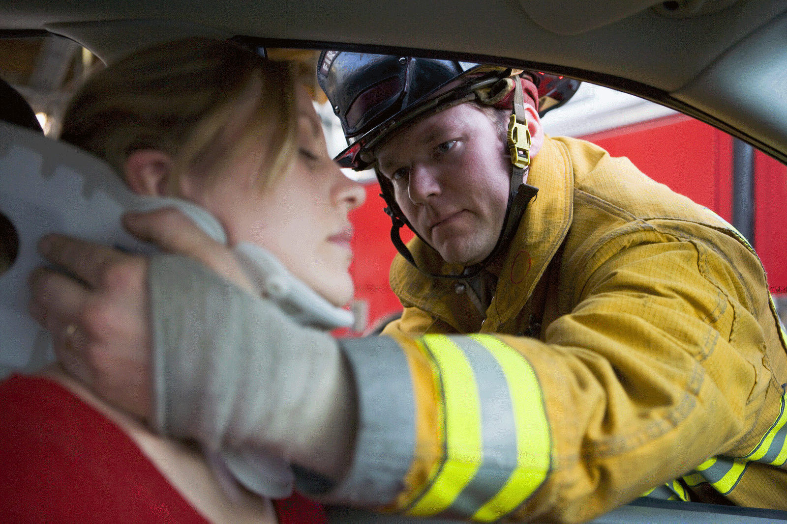 Picture of a firefighter helping a girl
