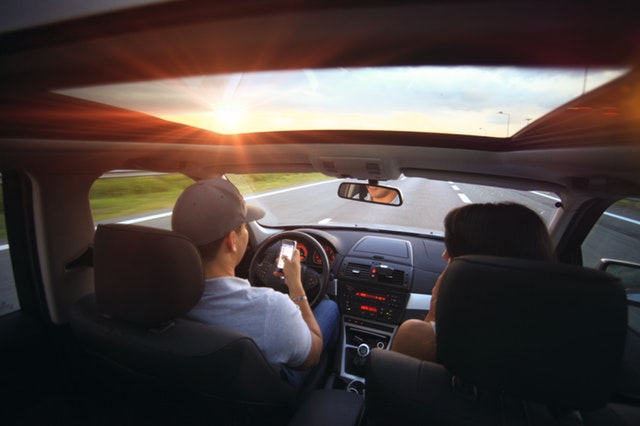 Picture of two person driving